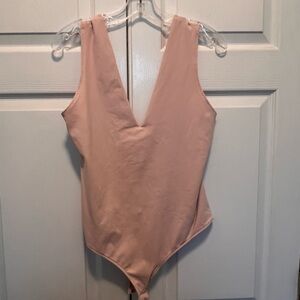 Free People V Neck body suit in light pink! Large